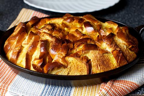 Remove from oven and run a knife around edge of dish, loosening bread from sides.   
