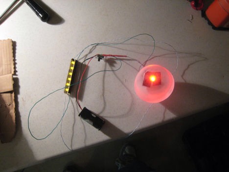 Then I wired both of these up to the switch, resistors, and battery pack. Using shrink tubing to cover up all the wires.

I then used hot glue to get the LED's secured, then covered up the bare wiring with black electrical tape. I set it aside as I now had to do some sewing.