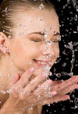 Splash your face with cold water as soon as you wake up! It will help wake you up.