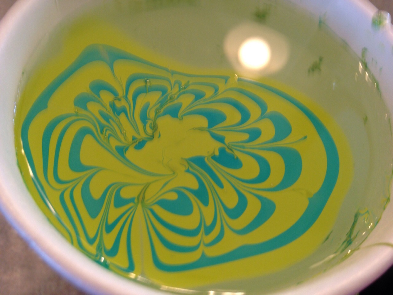 Swirl the nail polish with a toothpick until you get your desired pattern