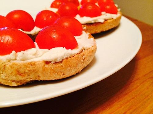 Toast another whole-grain bagel and add delicious vegan cream cheese! I used GO Veggie! brand. Smear it on, add some sliced cherry tomatoes, and enjoy this refreshingly simple lunchtime munch.