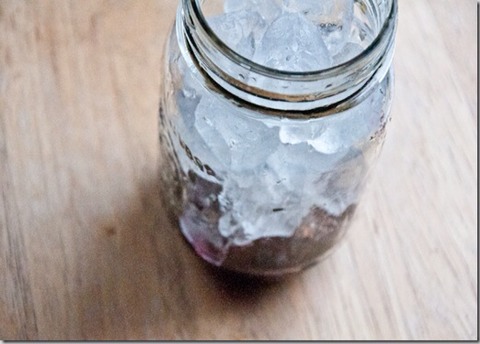Once the 12 hours (or 24, or 36) are up, strain the vodka. Save those liquor-soaked berries for garnish!In a small bowl, thaw out the frozen berries and mix with sugar. In a fresh mason jar , pour in the sugared berries (divided between two jars) and add a bunch of ice.