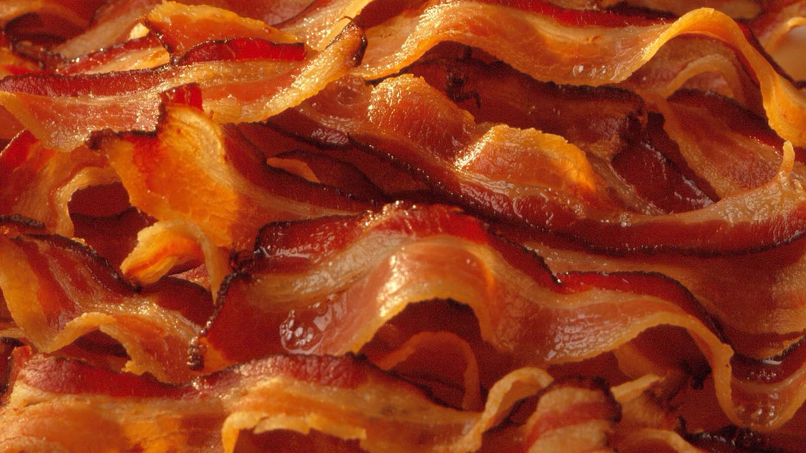 If you have nothing against bacon try this out. 
Take as much slices as you want to put into your pasta. 
Fry your bacon until it's pink and take it out of the pan. Cut it in squares. 
Pour mostly of the bacon grease in the pan in the sink and put the pasta in the pan and put it back on the fire. 