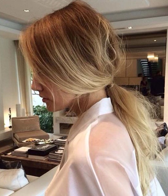 the messy low pony
this hairstyle is simply pulling your hair back into a ponytail and teasing the top and pulling out bits and pieces. it's pretty easy!

