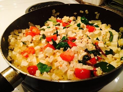 Grab some extra-firm tofu (don’t forget to drain it!). Cut your tofu into little cubes and toss ‘em in the pan with the veggies. Keep everything in the pan (stirring constantly!) until your masterpiece is done.