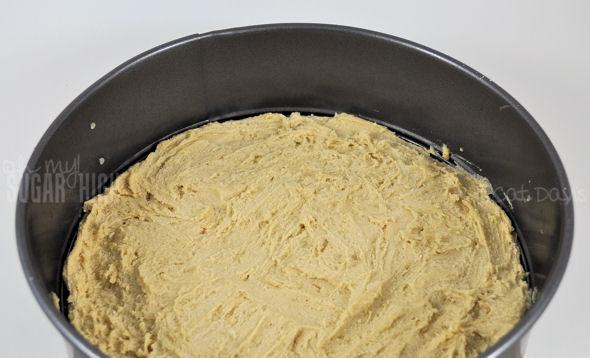 3. Using a (ungreased) 10 Inch Springform Pan, spread the cookie dough evenly across the base. Bake for 13 minutes and remove.