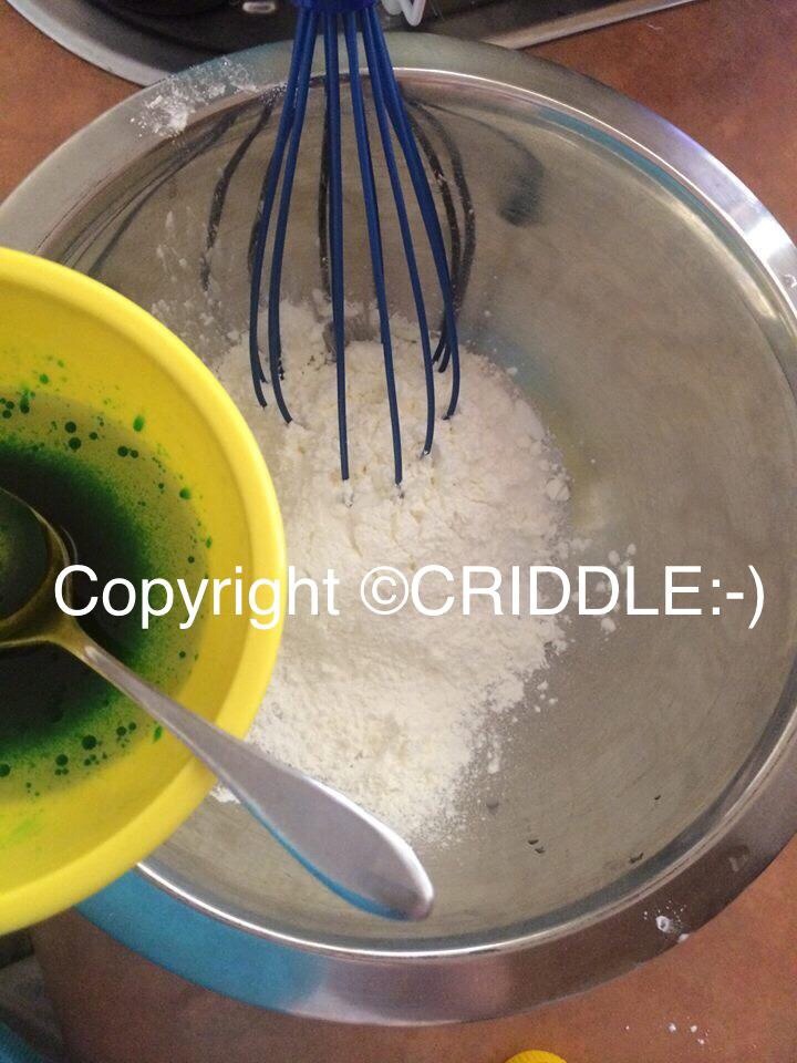 Mix all the wet ingredients together in a small bowl. Then very slowly add the wet ingredients to the dry ingredients mixing it as you go (if it starts fizzing your doing it too fast quickly mix it into to dry ingredients to stop the reaction