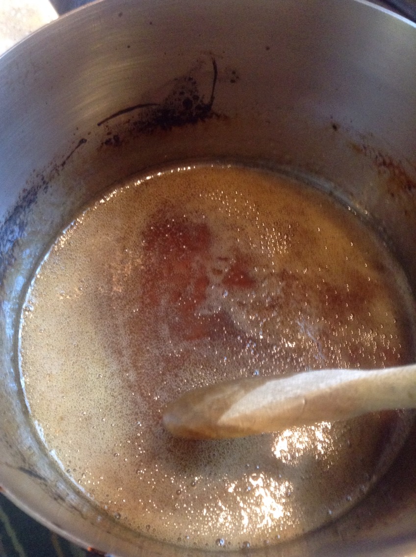 After continually stirring the mixture while it's being heated You should eventually get this beautiful honey color. Now take off the heat and pour the wax into a jar, glass, or bowl type thing. Just whatever container you'll be taking it out of.