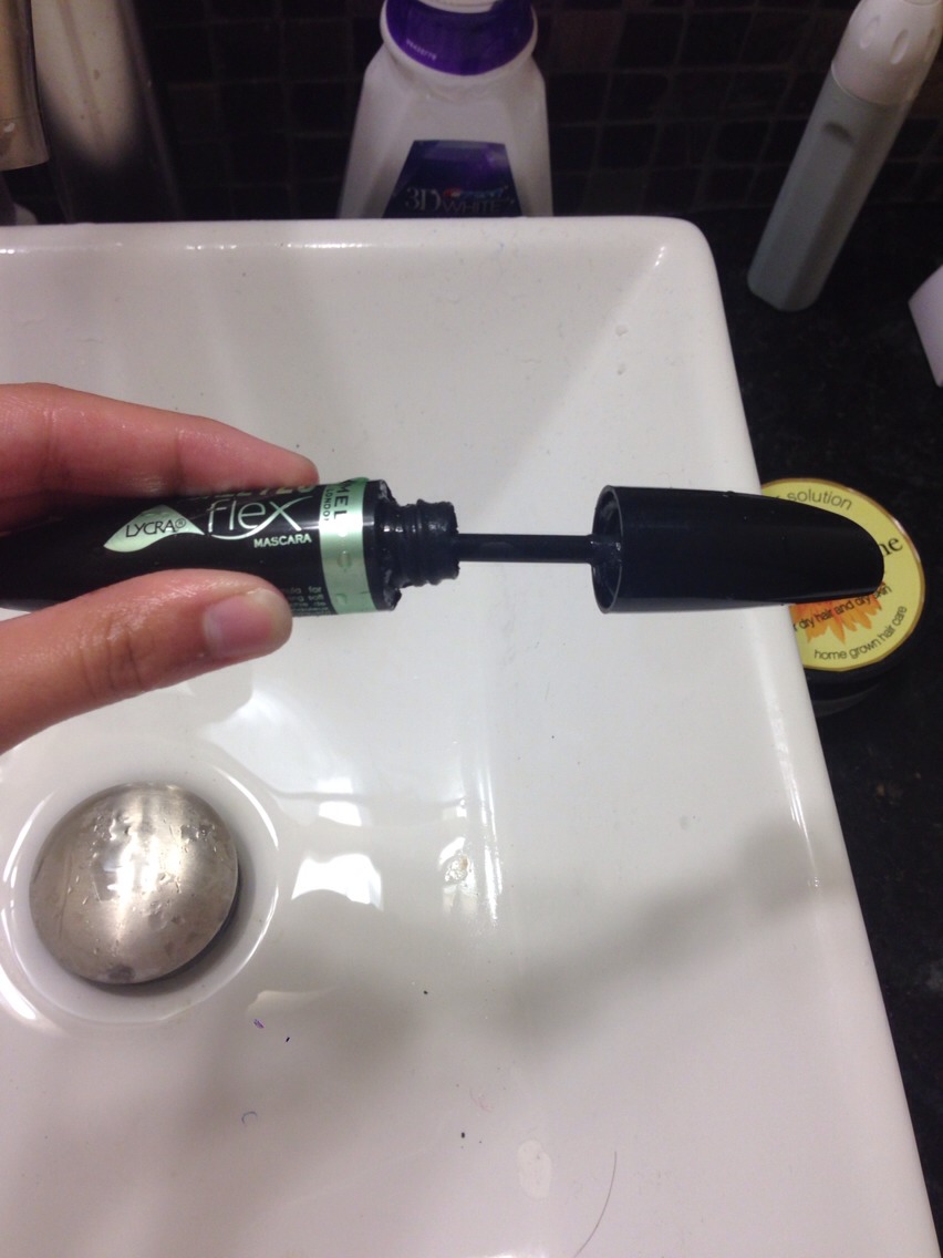 Put the brush back into the bottle and scrub all around in the bottle with the brush to remove excess mascara