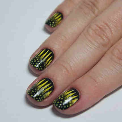 4. Grab a nail art brush and paint lines (similar to zebra stripes) coming off the bottom of the nail. 