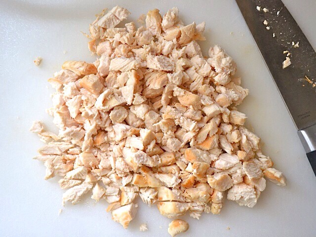While the rice cooks (this should take about 30-40 minutes), chop your uncooked chicken into cubes and place in hot pan with a bit of olive oil.