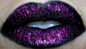 4. Get your preferred glitter. Still using the lip brush, pat the glitter gently in a small area at a time to get a nice covering. DO NOT smear. I like to just do it in the center of both lips (not all the way to the edge) so the black still shows. This is with Very Pink: