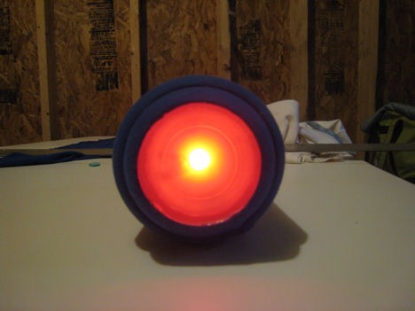I hot glued the fabric to the inside of the gun tip end of the mega buster to hold it in place. I pulled the cloth tight down the body of the Mega Buster. Then I cut open the hole for the power meter and wrapped the cloth around the edge of the opening and hot glued in place.