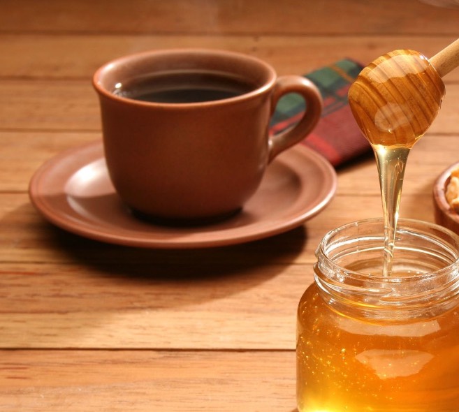 Coffee grinds or honey to remove hair. 
This is FALSE! 
Caffeine actually helps hair growth and honey is antibacterial/ good for face scrub
Neither have any properties that would prevent hair growth or slow it down!