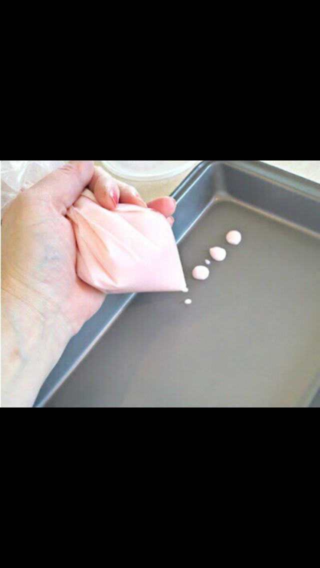 Spoon yogurt into a ziplock bag and cut a small hole in the corner. Squeeze the bag and make the dots as big as you want (normal is a little bigger than your thumb nail)