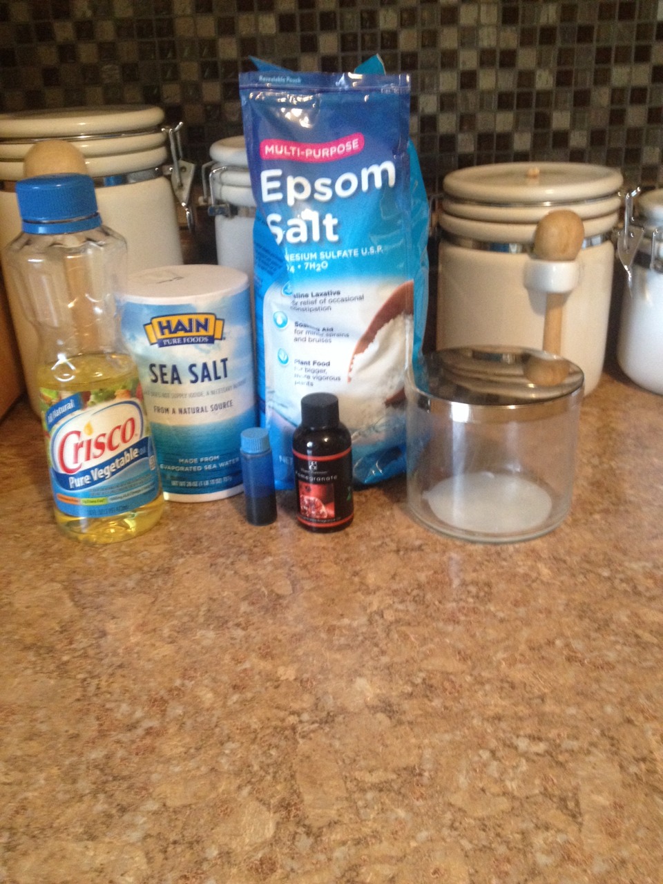 What you will need: 
•Epsom salt (I got it at walmart)
•Vegetable oil of your choice
•scented oil
•food coloring (optional)
•sea salt (optional)
•something to put it in, I used an old Bath and Body Works large candle holder
