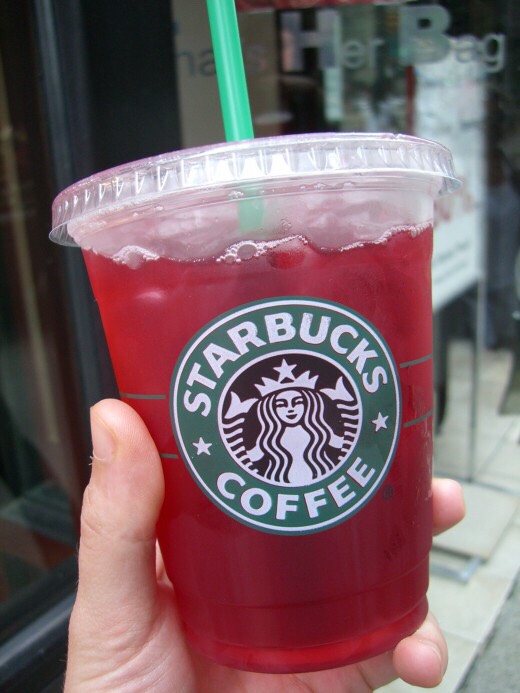 Raspberry Iced Tea: 
Order a iced half green, half black tea & add 2-4 pumps of raspberry syrup 