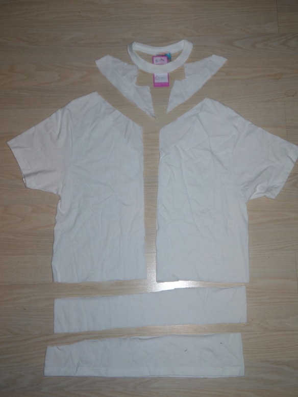 Cut the 2nd shirt following this pattern. The v-neck is cut lower in the front than the back. The top piece will be used for the top and the middle part will be the waistband. The bottom part and the extra from the top will be discarded.