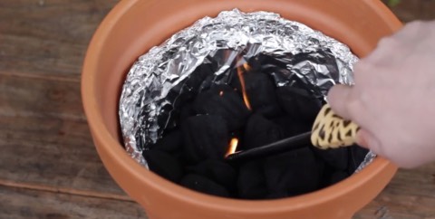 5. Light the charcoal and put your grill top on. It will take about 10 minutes to heat up.