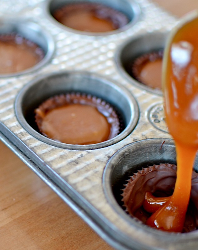 Then you just fill your cups with your homemade caramel and paint some more chocolate over the top. 

Here's a really professional picture of me filling the cups with caramel.