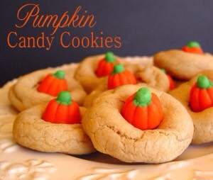 Cook regular cookies and when there still soft  add a piece of candy in the middle 