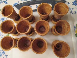 Look to see if there are any holes or open spaces in your "tea cups" and fill them with chocolate, so that your filling won't seep out.