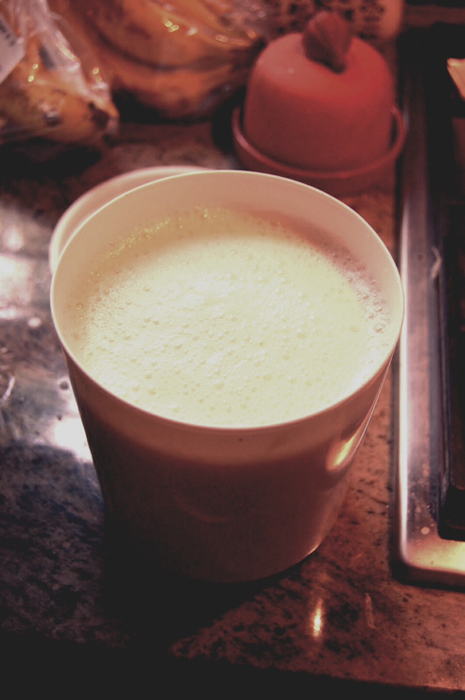 Place milk in microwave on high for 90 seconds then stir in sugar