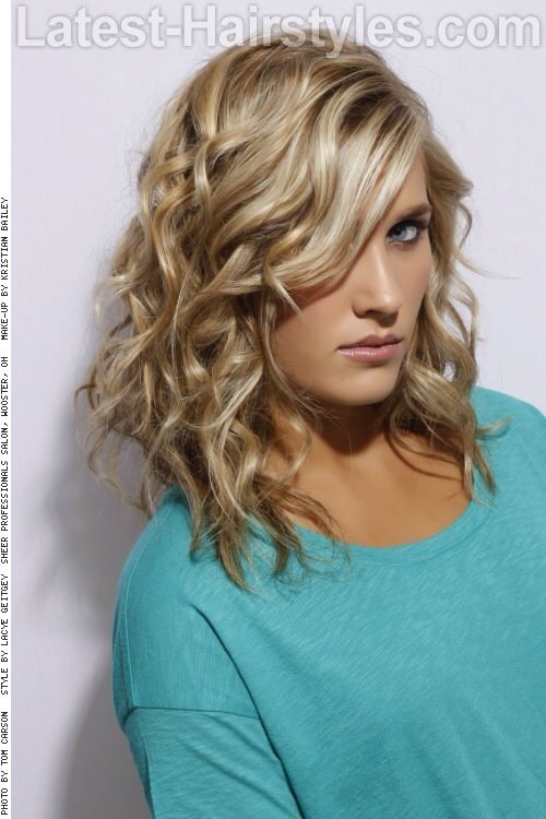 How To Style:

Apply a thermal protection to hair.
Curl sections of hair using a large barrel iron.
Apply a product for texture.
Set the style with a finishing spray.
