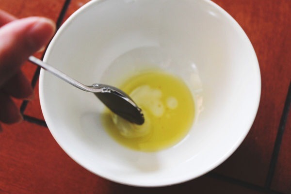 Step One
Using the mixing bowl, add your honey or agave nectar, then mix in the olive oil. This combination is super moisturizing on dry lips.