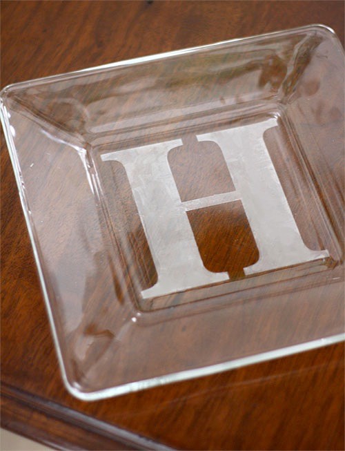13. DIY Personalized Casserole Dish Customize a casserole dish, wine glass, or anything else glass with a personalized monogram. If you have a computer and a printer, you can just find the font you like and print it out in the size you need for the stencil.