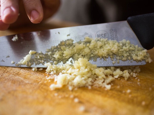 Add 8 cloves of minced garlic to the pan as well.