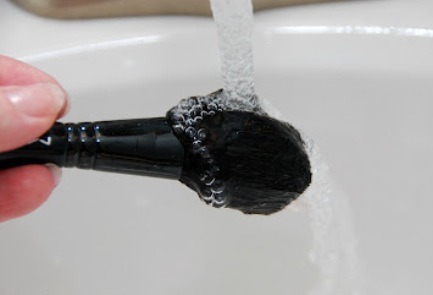 3. Rinse the brush tip under running water once again. Repeat steps two and three until the water runs clear from the brush.
