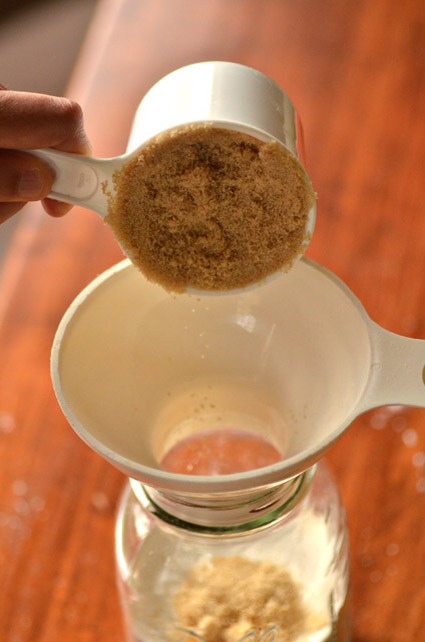 Place funnel inside the rim of the jar and add your brown sugar.