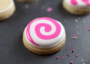  (Note: If the pink icing sits on the surface of the white without sinking in, then thin the icings a bit more)