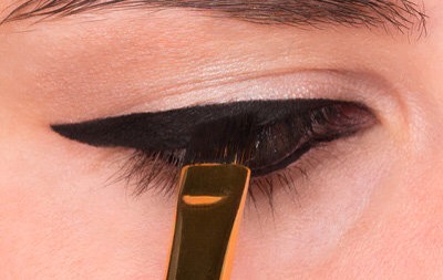 STEP 3
As you get closer to the inner lash line, paint a thinner line. You want the effect of the liner to be thin to thick from the inner corner of the eye to the outer.