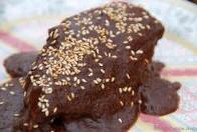 2 teaspoons salt
1/2 teaspoon pepper
1 cup water
3 large dried chilies
2 onions; chopped
2 cloves minced garlic
2 cups tomato sauce
1/3 cup sugar
1/4 teaspoon ground cinnamon
1 1 oz. square unsweetened baking chocolate
