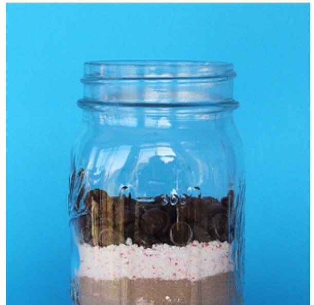 Then add the chocolate chips in the jar with the rest. Again make sure it's layered and spread out good.
