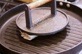 Use something heavy on it...flip it over when it's golden brown.
