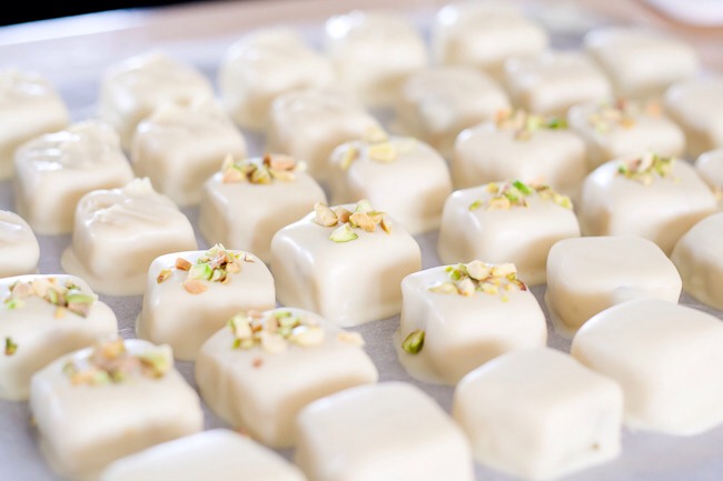 8.Place dipped truffle/candy on parchment paper, decorate as you wish and allow to set.

*Tip: You can use transfers or sprinkle crushed pistachio or candied peel. You can also wait for the chocolate to be semi set then use your dipping fork to mark the top of the chocolate.