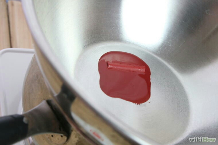 Once the coconut oil is melted add the crayon and allow that to melt. You can stir the mixture if you like.