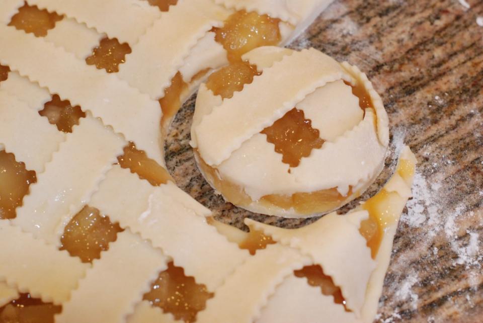 Taking a round cookie cutter, cut your cookies and lay on your cookie sheet. 