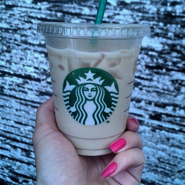 2. $2 Iced Lattes
Speaking of getting creative, you can score yourself a cheap "iced latte" if you order a triple espresso over ice in a Venti cup. Head on over to the condiment area to fill up your cup with milk.