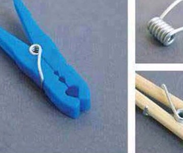 Break apart a cloth pin & hold on to the pin.