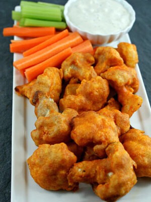 Cauliflower buffalo wings
1cup water/soy milk
1cup flour
2tsp garlic powder
1head cauliflower chopped
1cup buffalo sauce
1tbsp olive oil

Preheat oven to 450degrees F
water/soymilk+flour+garlic powder
Coat cauliflower in mix then place dish Bake for 18mins
PourBuffalo sauce+olive oil
bake for 5-8min