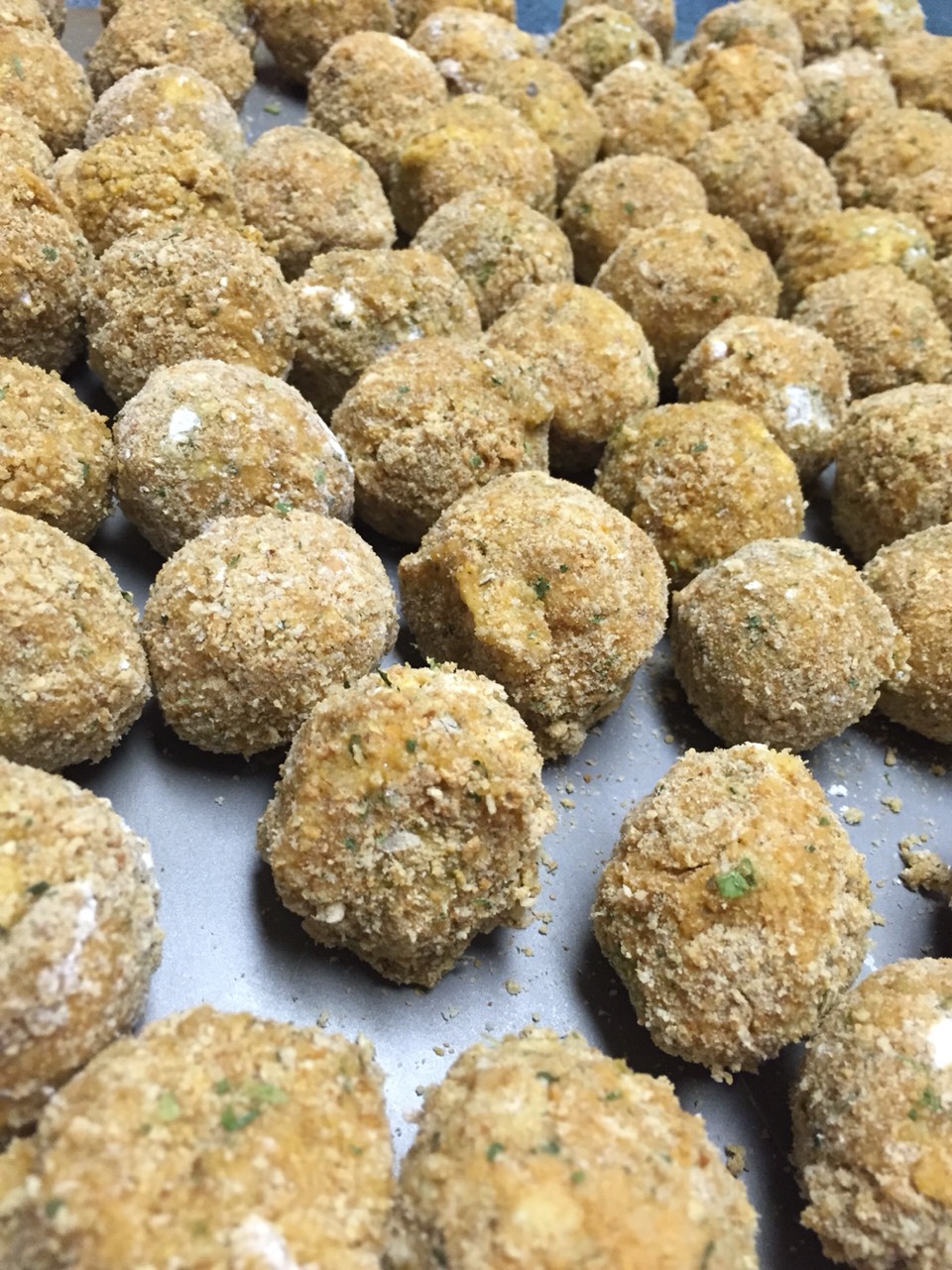 Freeze after olives are all rolled. 

This tray is ready for the freezer!

Let them sit in the freezer until hard or overnight. Place in ziplock bags when they are all frozen. 

Grab out as many as you want to cook at a time. The rest will last for up to a year. 