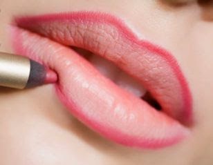 3. Apply lip liner. draw an X on your top lip for a Cupid's bow lip look