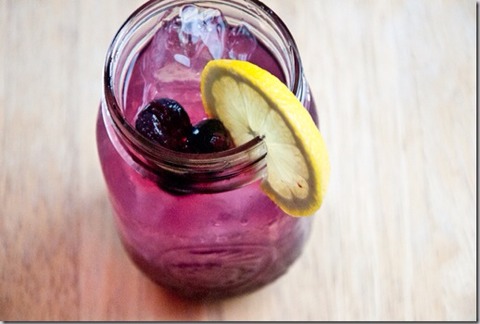 Pour in one part blueberry vodka and two parts lemonade. Give it a good stir. Add a few of the vodka-soaked blueberries and a slice of lemon for garnish.