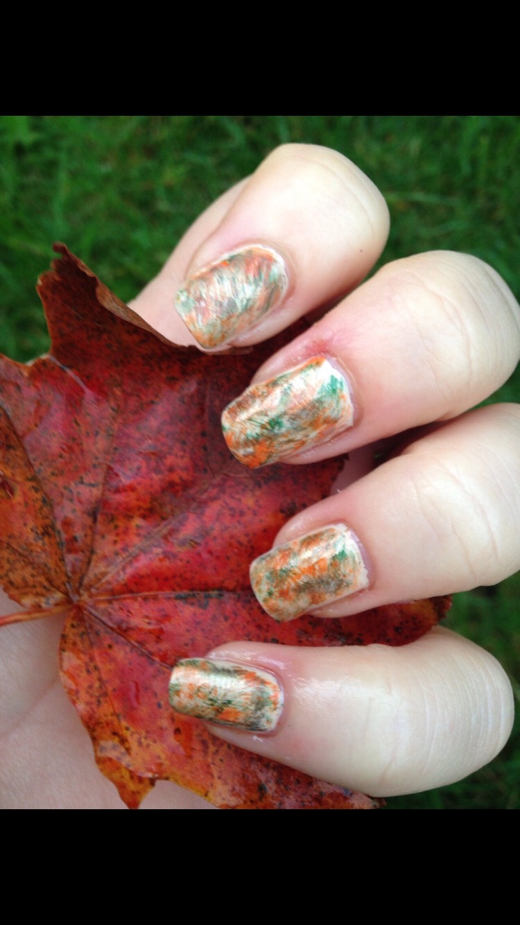 This is a cute polish to do if you like being creative! Add a gel coat of white polish to all nails, get a cotton ball, and put orange, light green and dark green on it (in separate areas of the ball) then start blotting it on the dry white polish! Clean up the cuticles with a cotton swab when done.