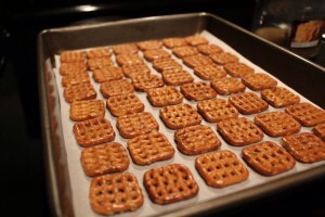 1. Preheat oven to 170 degrees. Line a baking pan with parchment paper. Arrange as many unbroken pretzels that will fit.