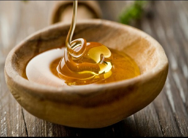 First, put one spoonful of honey in a small container or bowl.